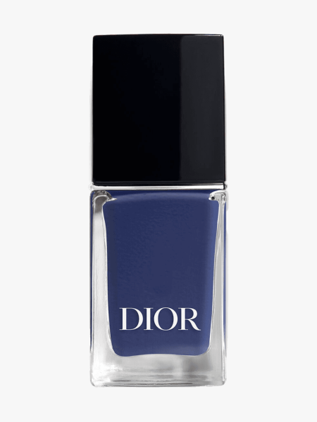 Dior Vernis Glossy Nail Polish in Denim in branded glass bottle with black cap on light gray background
